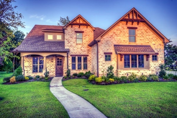 steps to buying a house for the first time brick house with a green lawn Middle Class Dad