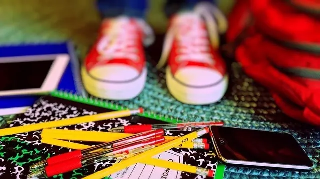 back to school tips for parents Middle Class Dad kids sneakers and a pile of colored pencils