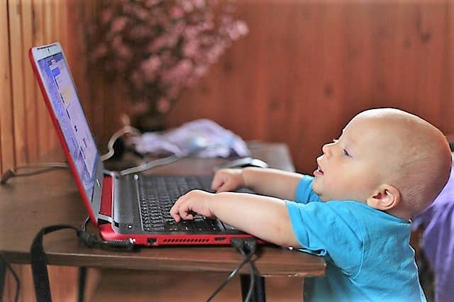 night-time-fears-in-children-baby-on-laptop-middle-class-dad