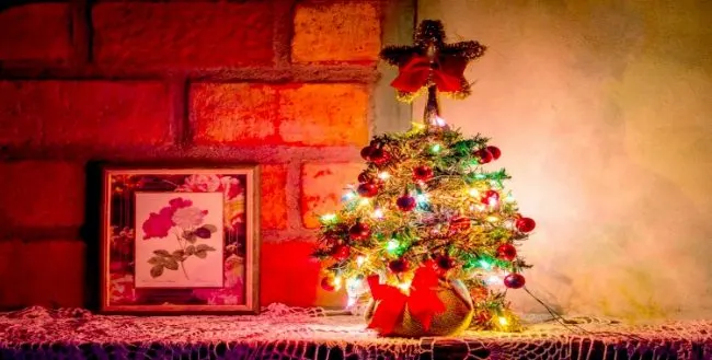 how to hang Christmas lights on brick walls Small Christmas tree on shelf in front of brick wall Middle Class Dad