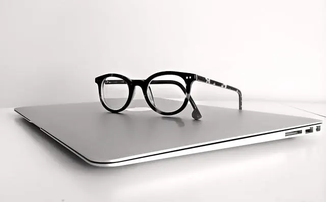 jobs college students can do online a pair of glasses sitting on a closed laptop