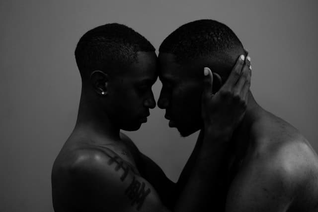 can a marriage last without intimacy? black and white photo of a Black couple shirtless holding each other's heads Middle Class Dad