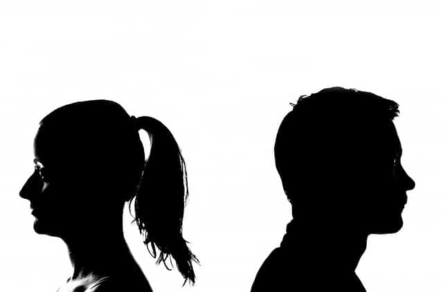 types of marital conflict black and white headshots of a man and woman facing away from one another