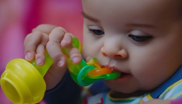 baby drinking from a straw