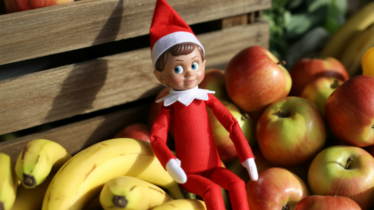 an Elf on the Shelf doll nestled amongst a vibrant pile of fresh produce